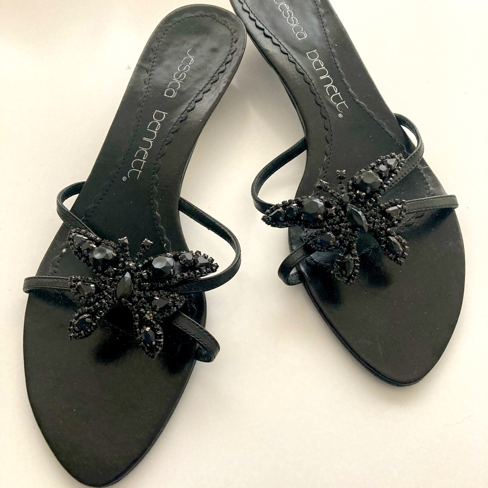 Black sandal with butterfly in stones.